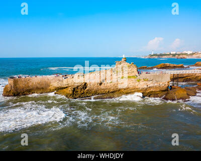 The rock of the Virgin or Le rocher de la Vierge is a tourist natural landmark in Biarritz city in France Stock Photo