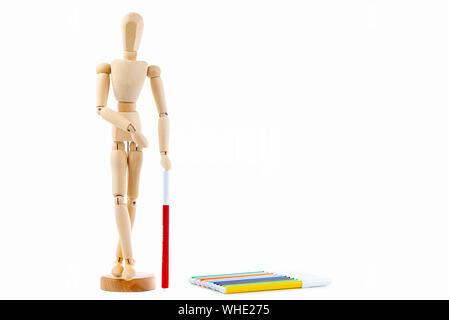 Small wood mannequin with Colorful markers on a white background Stock Photo