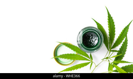 Cannabis paste and marijuana leaves isolated on white top view Stock Photo