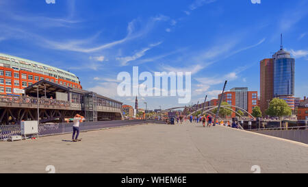Hamburg, Germany - tourists people having fun at the Hamburg sea port harbor pier on a sunny day in summer. Stock Photo