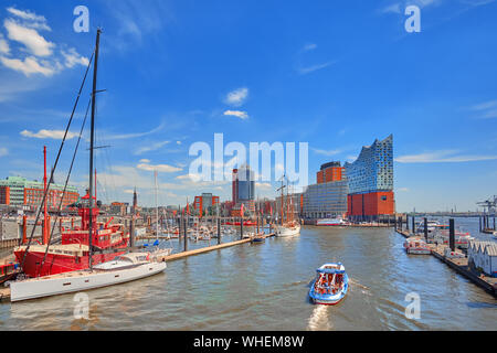 Hamburg, Germany - May 22, 2018: Beautiful view to the harbor yachts and city tour boats in Hamburg sea port on a sunny day in summer.