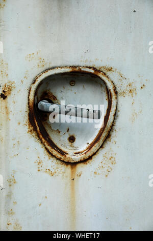 Rusty old door handle of 1950's bus Stock Photo