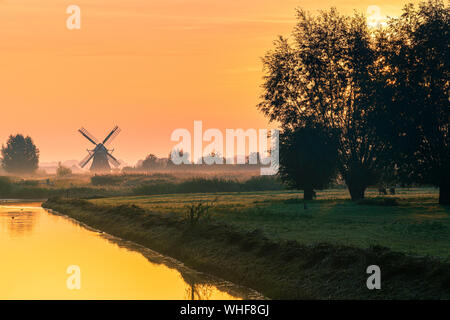Sunrise at the Noordermolen (Northern Mill), in Noorddijk in the province of Groningen, Netherlands Stock Photo