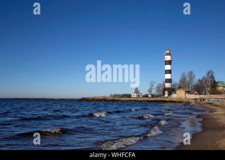 City Riga, Latvia. Lighthouse and mole at river Daugava. Stock Photo