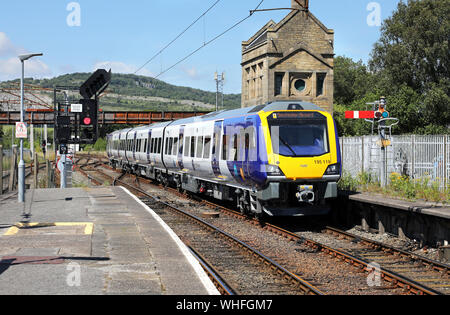 195119 arrives into Carnforth on 3.7.19 with a Barrow to Manchester Airport service. Stock Photo