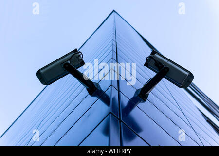 Two CCTV cameras on the cone of the morden building Stock Photo