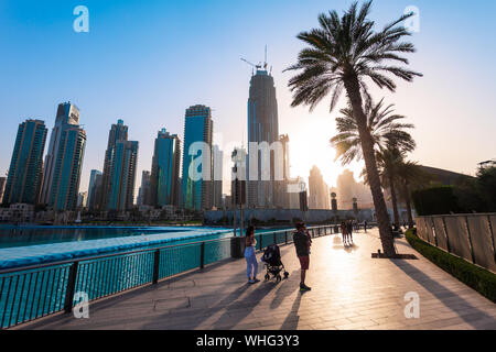 DUBAI, UAE - FEBRUARY 24, 2019: Promenade near the Burj Khalifa Tower and Dubai Mall in Dubai city in United Arab Emirates Stock Photo