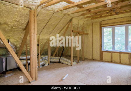 Foam plastic insulation installed in the sloping attic of a new frame house. Stock Photo