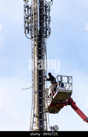 Radio mast, mobile radio, telephone, will be upgraded, equipped with new antennas. Germany Stock Photo
