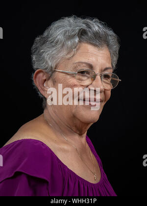 An elderly woman with gray hair wearing glasses Stock Photo - Alamy