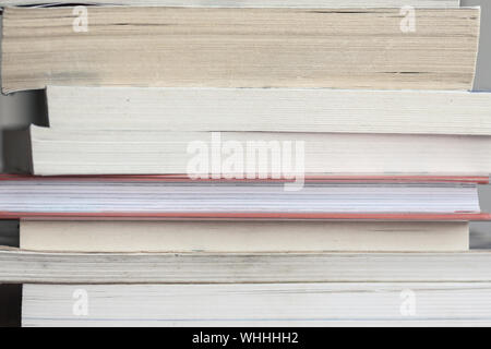 A large number of old books stacked on top of each other. Background shot, clean blank copy space Stock Photo