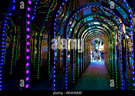 Tunnel of light and mirrors in the passage to Conduit Court in Covent Garden, London, UK Stock Photo
