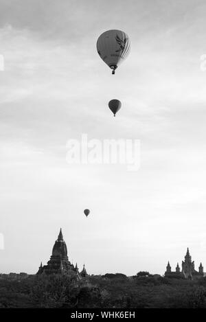 BAGAN, MYANMAR - 06 DECEMBER, 2018: Black and white picture of hot air balloons over the amazing ancient temples in Bagan, Myanmar Stock Photo