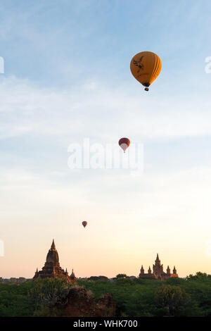 BAGAN, MYANMAR - 06 DECEMBER, 2018: Vertical picture of hot air balloons over the old temples in Bagan, Myanmar Stock Photo