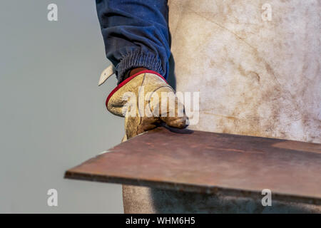 Motswana worker operating a Rolling Machine in a Botswana workshop Stock Photo