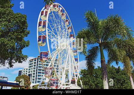 The newly erected Reef Eye ferris wheel attraction provides a scenic 10-minutes ride on the beautiful Cairns city esplanade Stock Photo