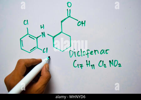 Diclofenac (C17,H11,CI2,NO2) molecule written on the white board. Structural chemical formula. Education concept Stock Photo