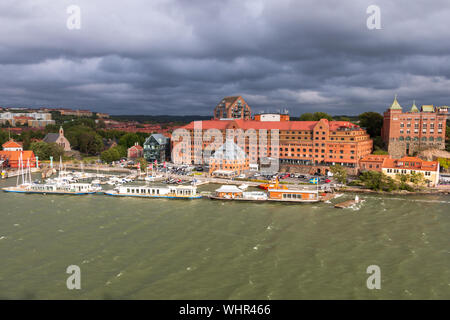 Gothenburg a beautiful city in Sweden, a view from the river Gota Alv on the shore line with boats and nice buildings Stock Photo