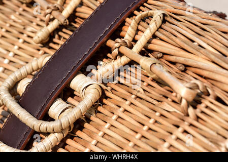 Detail of a bast basket, which is held together by a leather strap Stock Photo