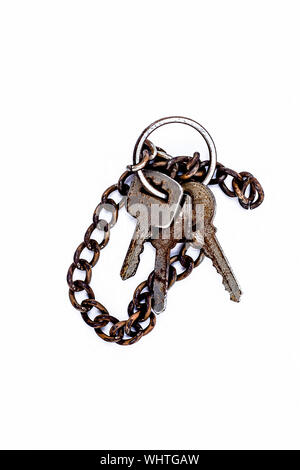 Close up of 3-4 keys with a keychain isolated on white. Stock Photo