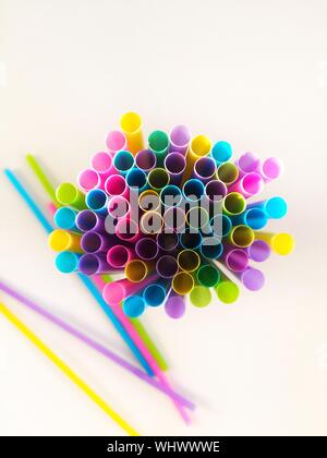 Directly Above Shot Of Colorful Drinking Straws Against White Background