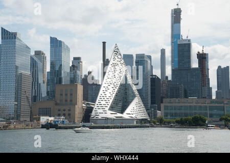 A building with 709 apartments on West 57th Street at the Hudson River in Manhattan has distinctive architecture by the Bjarke Ingels Group. Stock Photo