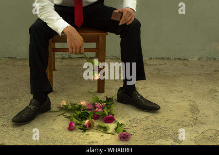 A brokenhearted man rejected on a date. Stock Photo