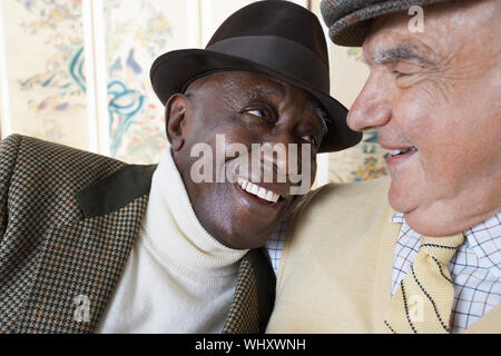 Closeup of cheerful multiethnic senior men smiling Stock Photo