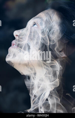 A beautiful naked girl hides her face. Nude Stock Photo - Alamy