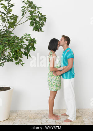 Profile of a man kissing a young woman's hand Stock Photo - Alamy