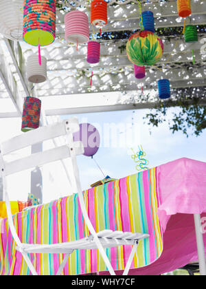 Outdoor table and decorated patio after birthday party Stock Photo