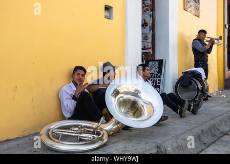 Mexican wedding music band having break on the street in Oaxaca, Mexico. Stock Photo