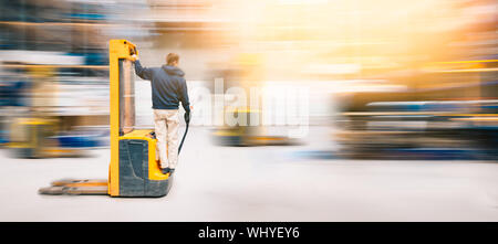 Forklift Worker In Motion AT Work in Warehouse  | Long Exposure Blurred Stock Photo