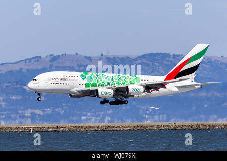 September 1, 2019 Burlingame / CA / USA - Emirates Airbus A380 aircraft with Expo 2020 Dubai livery landing at SFO; Green signifies the Sustainability Stock Photo