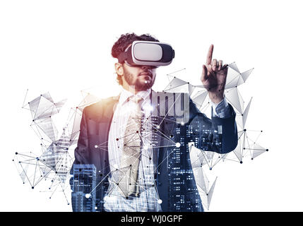 Businessman wearing VR headset working with virtual system. New reality modeling and design. Interacting with virtual interface. Mixed media with 3d o Stock Photo