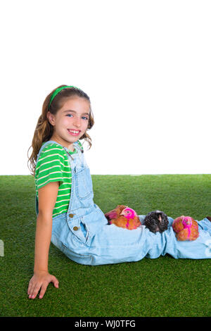 breeder hens kid girl rancher farmer playing with chicken chicks white background Stock Photo