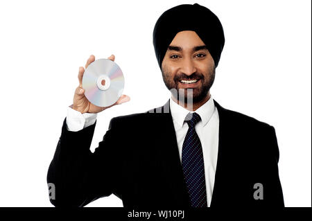 Smart executive holding a compact disc Stock Photo