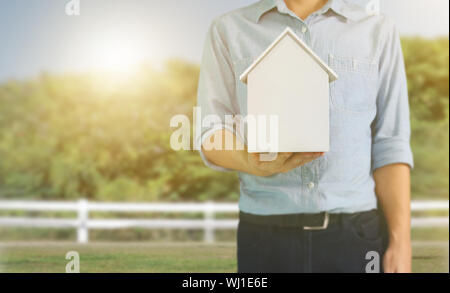 Residential Structure house human in hand Stock Photo