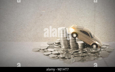 Car Model Over a Stacked Coin Stock Photo