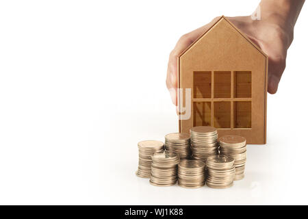 Hands holding  house homeless housing shelter and real estate , family house insurance concept Stock Photo