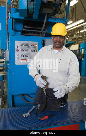 Portrait of an Afro American man working in newspaper factory Stock Photo