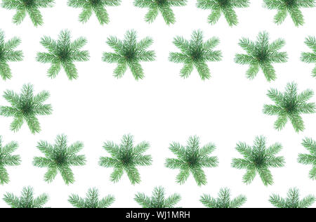 Christmas frame made of natural green fir tree branches as snowflakes on white background, isolated. Stock Photo