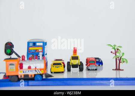 Toy cars waiting at railway crossing Stock Photo