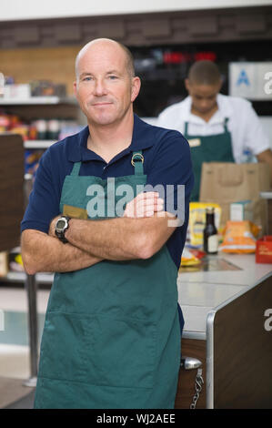 Portrait of a supermarket employee and checkout assistant Stock Photo