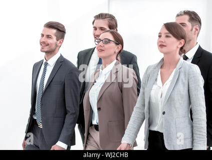 group of employees of the company confidently passes through the office hall Stock Photo