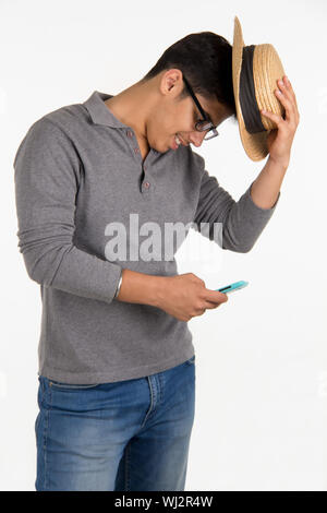 Young man text messaging on mobile phone Stock Photo