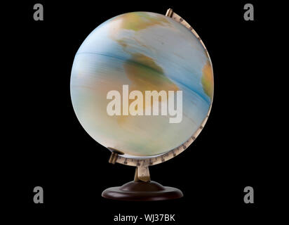 Close-up of spinning globe over black background Stock Photo