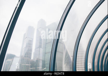 Moscow,Russia,1 November 2017. High skyscrapers buildings of Moscow International Business Center view through curved window in fog Stock Photo