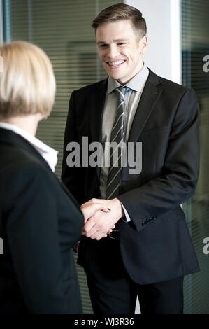 Two business people shaking hands Stock Photo