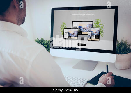 freelance graphic web designer working with  computer and graphic pen Stock Photo